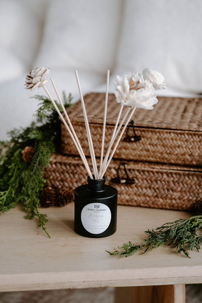 Balsam Fir handmade floral reed diffuser styled with cedar, pinecones and woven baskets