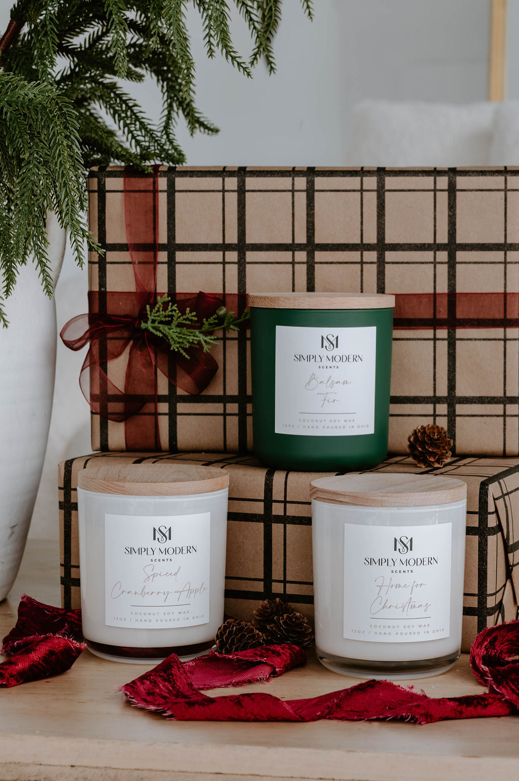 Holiday Candle Trio gift set — Balsam Fir in olive green, Spiced Cranberry Apple and Home for Christmas in white 12 oz vessels with plaid wrapped gifts