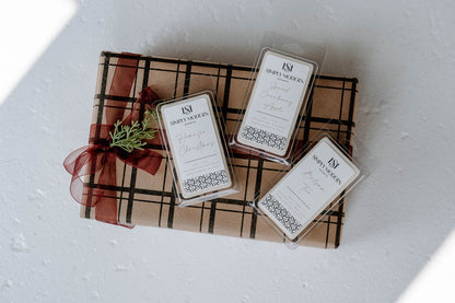 Holiday Wax Melt Trio — Home for Christmas, Spiced Cranberry Apple and Balsam Fir 4 oz coconut soy wax melts on a kraft plaid gift box
