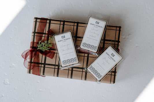 Holiday Wax Melt Trio — Home for Christmas, Spiced Cranberry Apple and Balsam Fir 4 oz coconut soy wax melts on a kraft plaid gift box